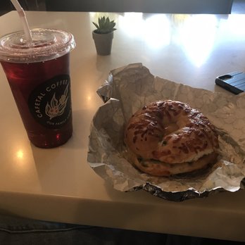 Cafetal Coffee - Prickly pear tea & cheddar Jalapeño bagel sandwich with Eggs, ghost pepper cheese & sausage - Coffee & Tea Near Me - Tempe, Arizona