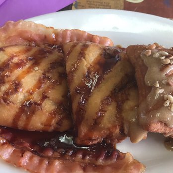 Beignet Au Lait - Molasses and bacon on the left praline and pecan on the right. - Breakfast & Brunch Near Me - Slidell, Louisiana Beignet Au Lait - Molasses and bacon on the left praline and pecan on the right. - Breakfast & Brunch Near Me - Slidell, Louisiana