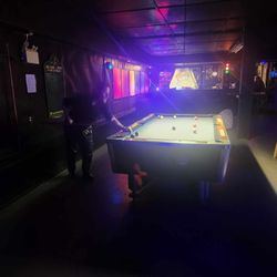 Zig's - My partner playing on one of the tables.