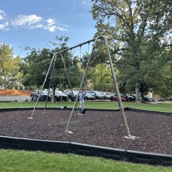 Crissie Caughlin Park - Playground swing set, also shows parking area