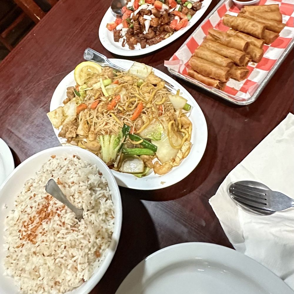Top to bottom: Crispy Binagoongan, Shanghai Lumpia, Pancit, Garlic Rice Top to bottom: Crispy Binagoongan, Shanghai Lumpia, Pancit, Garlic Rice