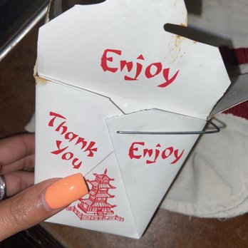 Hut Wok - a hand holding an envelope with a thank you written on it - Chinese Near Me - Prairieville, Louisiana