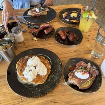 Brunch & - Prosciutto & Egg Avocado Toast (split), Better Than... Pancakes (single), Blueberry Lemon Curd Pancakes (single), side of bacon and sausage. - Breakfast & Brunch Near Me - Estes Park, Colorado Brunch & - Prosciutto & Egg Avocado Toast (split), Better Than... Pancakes (single), Blueberry Lemon Curd Pancakes (single), side of bacon and sausage. - Breakfast & Brunch Near Me - Estes Park, Colorado