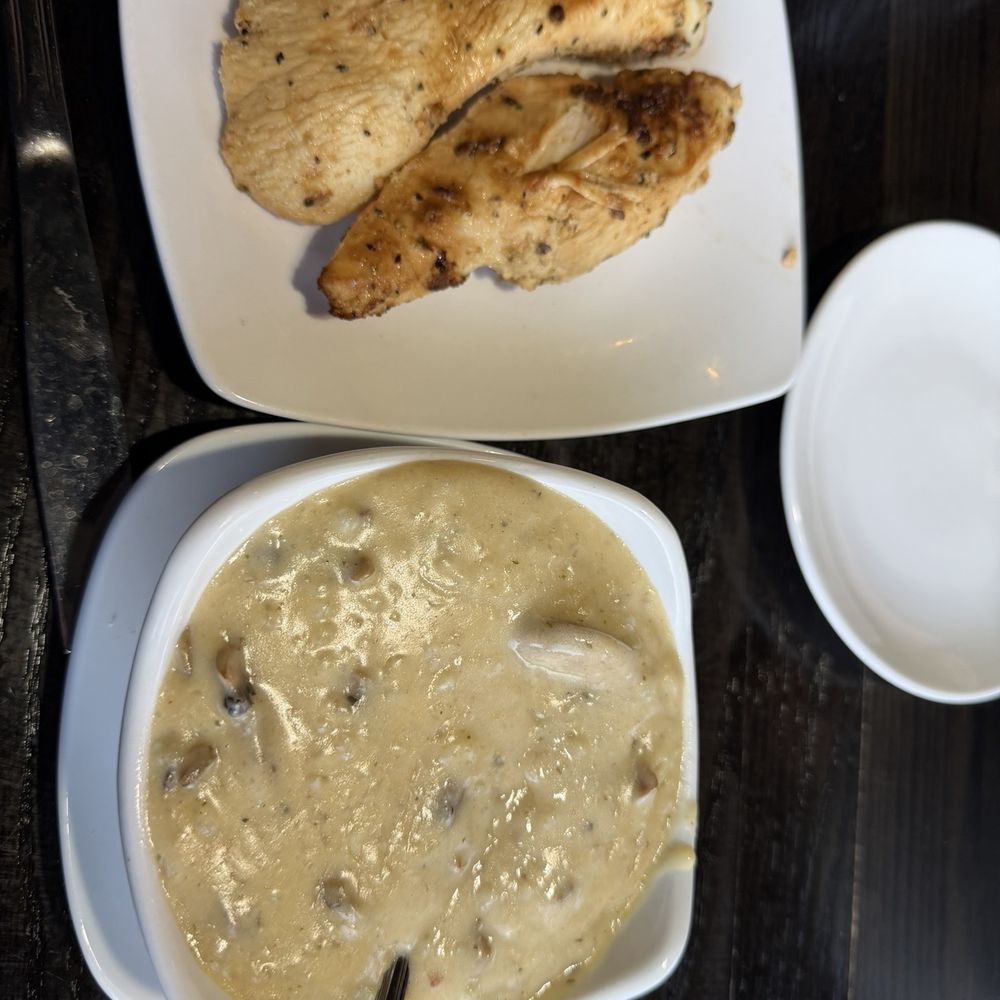 Grand Tavern Troy - Cup of mushroom soup with grilled chicken breast on the side - New American Near Me - Troy, Michigan