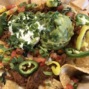 New Belgium Brewing - Mile high pork carnitas nachos - Beer Bar Near Me - Denver, Colorado New Belgium Brewing - Mile high pork carnitas nachos - Beer Bar Near Me - Denver, Colorado
