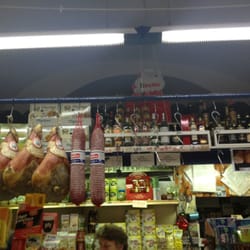 Alimentari Il Bocconcino - Meat hanging throughout the deli