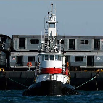 On Scene Marine Service - tug towing old long . island rail road cars to reef off marches. - Boat Repair Near Me - Saint James, New York On Scene Marine Service - tug towing old long . island rail road cars to reef off marches. - Boat Repair Near Me - Saint James, New York