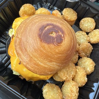 Two Fold Coffee & Kitchen - Egg and cheese breakfast sandwich on a croissant with hashbrowns - Coffee & Tea Near Me - Tampa, Florida