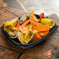 The Blue Dolphin - Big flavors. Real seafood experience.
Loaded with shrimp, crab, mussels, corn, and more -- seasoned to perfection and ready to satisfy.