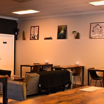 Alchemist Kava - a living room with a couch and a table - Coffee & Tea Near Me - Naples, Florida