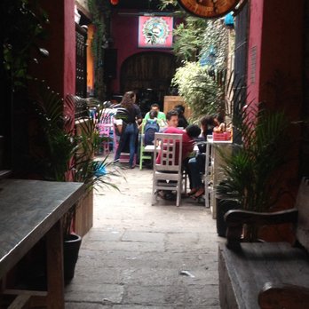SuFrida - Entrance of SuFrida. It has tables outside and indoors. - Chicken Wings Near Me - Heroica Puebla de Zaragoza, PUE