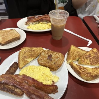 The Brothers Cafe - Golden Brown French Toast Deluxe Two 2 Eggs with Bacon Platter Iced Tea Iced Coffee - Breakfast & Brunch Near Me - Sunnyside, New York