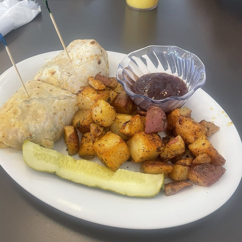 Eggs Up Grill - Carne Asada Breakfast Burrito with home fries, bbq sauce and OJ - Breakfast & Brunch Near Me - Winter Garden, Florida Eggs Up Grill - Carne Asada Breakfast Burrito with home fries, bbq sauce and OJ - Breakfast & Brunch Near Me - Winter Garden, Florida