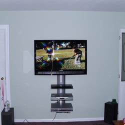 TV Install NJ - This TV was installed in the Living Room with a 3 Tier shelf system.