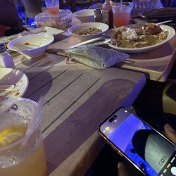 Hurricane Harry's Island Vibes - Two empty plates and full cups the drinks where to strong