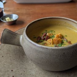 Land to Sea - Cream of yellow tomato soup with pancetta and other things