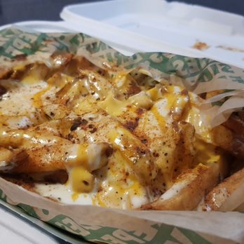 Wingstop - a tray of french fries with cheese - Chicken Wings Near Me - Levittown, New York