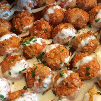 Dish & Design - Customer favorite! Buffalo chicken sausage with blue cheese creme and chives drizzled on top - Caterers Near Me - Mount Pleasant, South Carolina