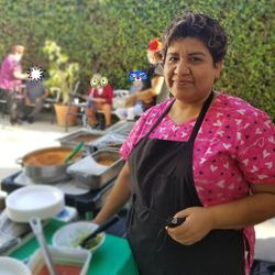 The Cottages at Artesia - One of our wonderful cooks serving our residents during the Mexican fiesta.