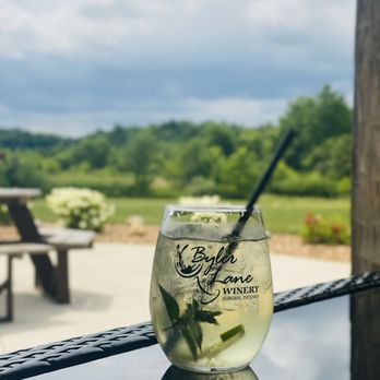 Byler Lane Winery - a glass of wine with a straw and a straw in it - Wineries Near Me - Auburn, Indiana Byler Lane Winery - a glass of wine with a straw and a straw in it - Wineries Near Me - Auburn, Indiana