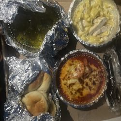 Napoli's Italian Restaurant - Garlic knots, garlic and basil oil, child size chicken Alfredo and the "Pasta Sampler. "