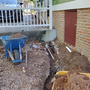 Mr. Plumb-It-All - Water service being sleeved and fed beneath driveway to the rinnai, avoiding surface mounting. - Plumbing Near Me Mr. Plumb-It-All - Water service being sleeved and fed beneath driveway to the rinnai, avoiding surface mounting. - Plumbing Near Me