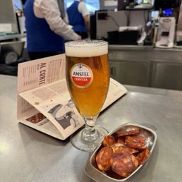 Cold Amstel and some delicious chorizo.