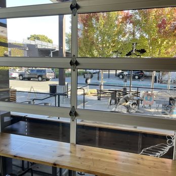Taylor Lane Organic Coffee - From a bar window, my puppy sitting outside and waiting. Hee. Patio seating area. - Coffee Roasteries Near Me - Sebastopol, California Taylor Lane Organic Coffee - From a bar window, my puppy sitting outside and waiting. Hee. Patio seating area. - Coffee Roasteries Near Me - Sebastopol, California