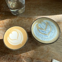 (Left) cortado w oat milk, (right) triple blue seasonal special