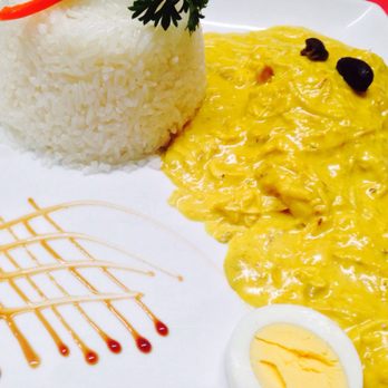 Chez Cesar - a plate of food with rice and sauce - Peruvian Near Me - Longueuil, Quebec Chez Cesar - a plate of food with rice and sauce - Peruvian Near Me - Longueuil, Quebec