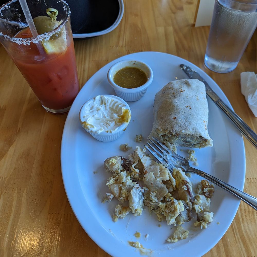 Big delish Bloody Mary and giant breakfast burrito, salsa and crema Big delish Bloody Mary and giant breakfast burrito, salsa and crema