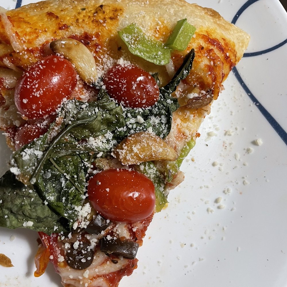I added vegan Parmesan at home - this one had less than half the toppings that I ordered
