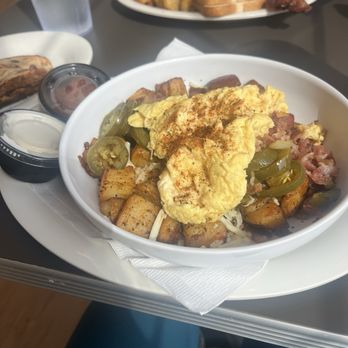 Eggs Up Grill - Southwestern bowl -- home fries, scrambled eggs, jalapeños, bacon, salsa and sour cream - Waffles Near Me - Huntsville, Alabama Eggs Up Grill - Southwestern bowl -- home fries, scrambled eggs, jalapeños, bacon, salsa and sour cream - Waffles Near Me - Huntsville, Alabama
