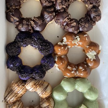Doughchii Mochi - Top to bottom: Chocolate Pebble, Ube Oreo, Dough-chii de Leche, Cookie Butter Nutella, Matcha Pockey - Donuts Near Me - Ceres, California