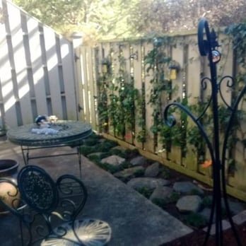 Sprucing Up GA - After photo- all the leaves, debris and old mulch have been removed.  Overgrown Ivy was trimmed back. - Gardeners Near Me