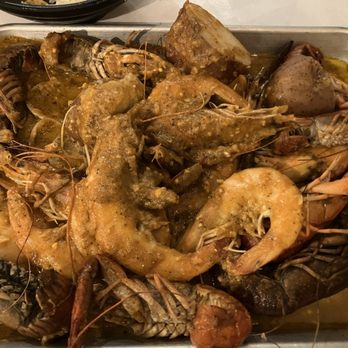 Craving Crab Haus - Head on shrimp with crawfish and potatoes and rice as sides. Covered with the whole-shebang sauce (all their flavors mixed) mild heat. - Cajun/Creole Near Me - Riverside, California