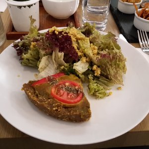 Photo of MyRaw Café - Prague, Czech Republic. Raw Spinach Quiche, Lettuce &amp; Mustard Dressing