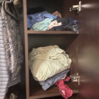 Vivante Newport - Laundry and housekeeping would just toss my mother's clean clothes in her armoire like this. I spent every visit organizing her clothes. - Retirement Homes Near Me - Costa Mesa, California