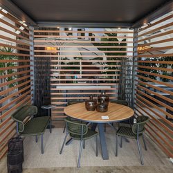 Terra Outdoor Living - Mariposa seating in olive  around the Portola dining table under a TUUCI cabana.