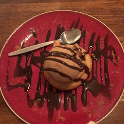 Mr. Haz Tacobar - House-made Spicy Cinnamon and Chocolate Ice Cream on top of a Churro