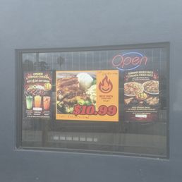 Exterior outside entrance of Muy Bien Teriyaki - Front of store deals on window - El Monte, California Exterior outside entrance of Muy Bien Teriyaki - Front of store deals on window - El Monte, California