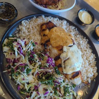 California Fish Grill - Swai grilled plate with garlic butter and Cajun with side of Coconut shrimp! - Seafood Near Me - Redlands, California