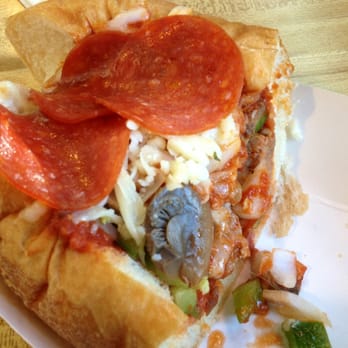 Papa's Italian Sausage - half a Papa's Pizza Sub: sausage, olives, mushrooms, onions, peppers, pepperoni, and provolone on a soft white bun - Italian Near Me - Kalamazoo, Michigan Papa's Italian Sausage - half a Papa's Pizza Sub: sausage, olives, mushrooms, onions, peppers, pepperoni, and provolone on a soft white bun - Italian Near Me - Kalamazoo, Michigan