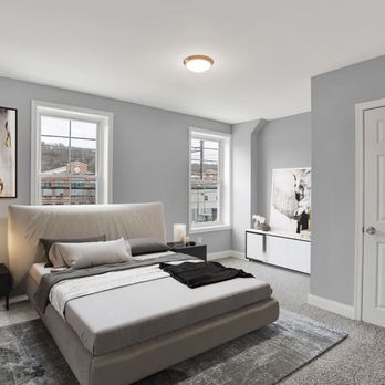 GO Properties - a bedroom with a large bed and two windows - General Contractors Near Me - Collegeville, Pennsylvania GO Properties - a bedroom with a large bed and two windows - General Contractors Near Me - Collegeville, Pennsylvania
