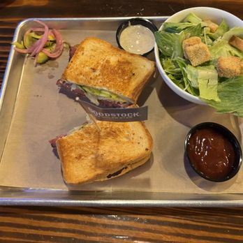 Barrel & Bones - Spicy Pastrami Brisket sandwich with a side salad. - Barbeque Near Me - Dallas, Texas