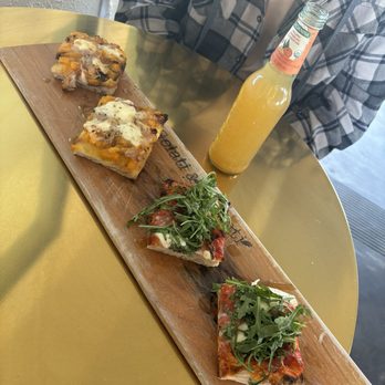 Gelati & Peccati - a table with a glass of orange juice - Pizza Near Me - Encinitas, California Gelati & Peccati - a table with a glass of orange juice - Pizza Near Me - Encinitas, California