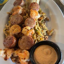 Acadian Grille Scratch Kitchen - Gator sausage and shrimp skewers over dirty rice