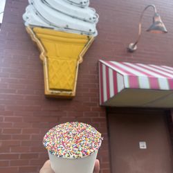 Dot cake ice cream sundae = vanilla ice cream, vanilla cake, buttercream icing, rainbow nonpareils