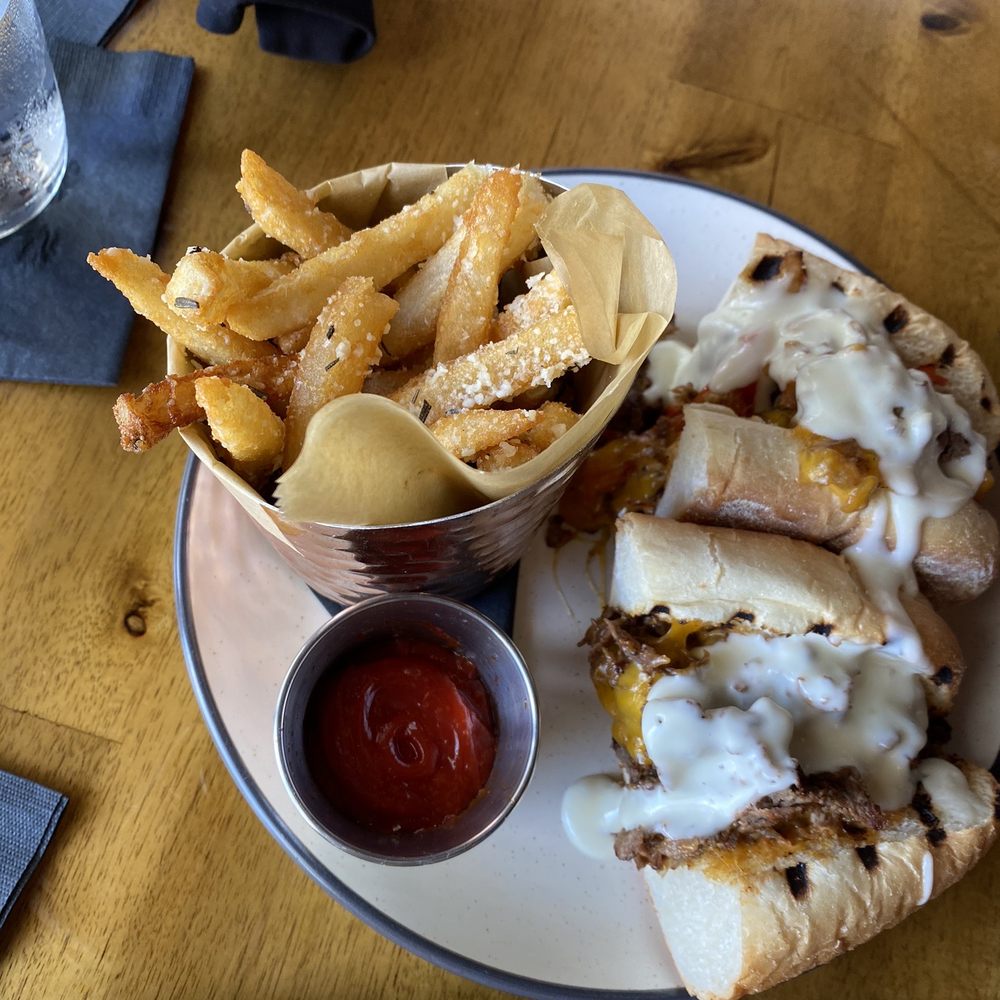 The Stubborn Mule - Chipotle Cheesesteak Sandwich, and Rosemary fries - New American Near Me - Orlando, Florida The Stubborn Mule - Chipotle Cheesesteak Sandwich, and Rosemary fries - New American Near Me - Orlando, Florida