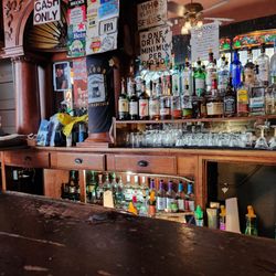 The Saloon - The bar. Notice the cut up beer boxes posted so you know what they have.